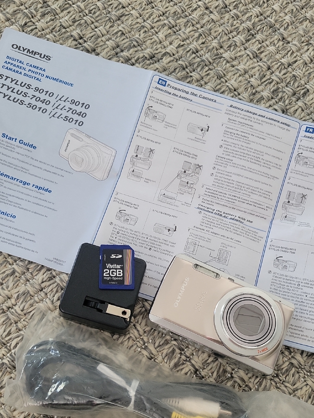 Olympus compact digital camera in champagne and silver